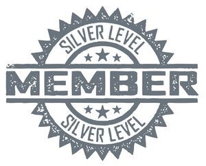 Silver level member badge with a starburst design.